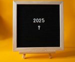 Chalkboard with '2025' on bright yellow background, symbolizing a fresh start to the new year.